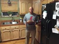 Marc Brown with game ball after first win as head coach over white castle
